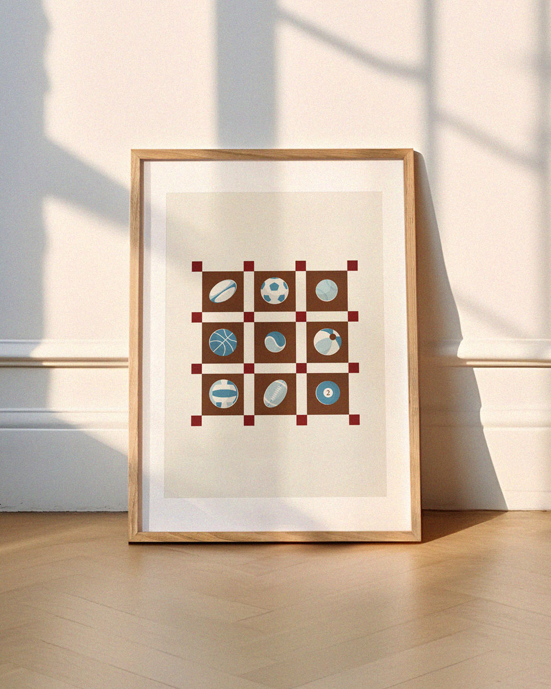 Kids sports wall art print with nine illustrated balls in a blue and brown patchwork grid